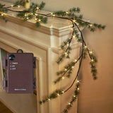 Fudios 6-foot lighted Christmas pine garland with 48 warm white LED lights draped over a fireplace mantel indoors - view 6