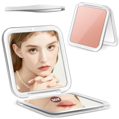 MIYADIVA gold compact folding mirror open showing 30X magnifying side and 1X side with chrome tweezers beside it