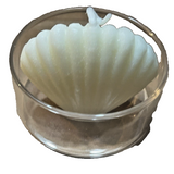 Four handmade seashell-shaped floral scented candles displayed with one small clear glass holder on a decorative surface - view 3