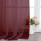 Pair of burgundy sheer voile rod pocket curtain panels 40x108 inches hanging on a window, LeCloud - view 6
