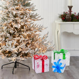 Three lit Christmas gift boxes in small, medium, and large sizes with red, green, and blue bows glowing with warm LED lights - view 7