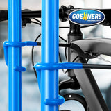 GOEHNER's green steel freestanding 4-bike storage rack with rubber-coated hooks standing upright in a garage - view 4