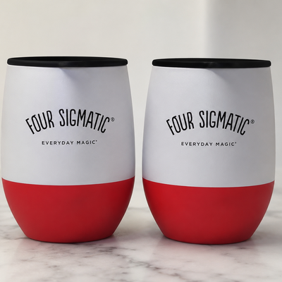 Two white Four Sigmatic 12oz stainless steel insulated travel mugs with spill-proof lids and silicone sleeves