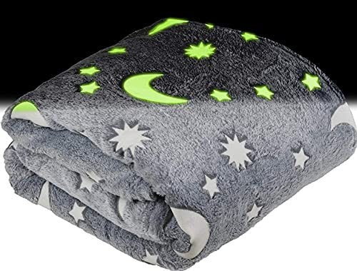 Grey fleece throw blanket with glow-in-the-dark stars and moons pattern, 50x60 inches, folded on white background