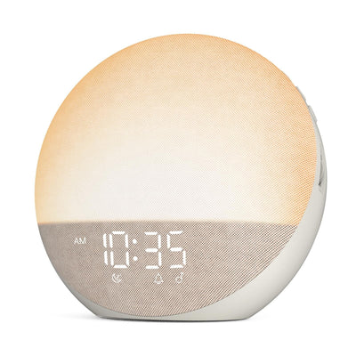 Odokee H03 putty beige sunrise alarm clock and white noise machine with soft cloth exterior on bedside table