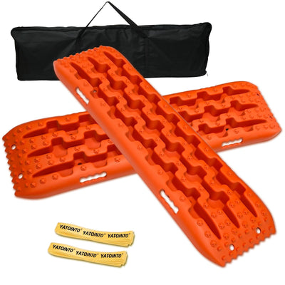 Pair of orange YATOINTO 4x4 off-road recovery traction boards with storage bag and nylon straps on white background