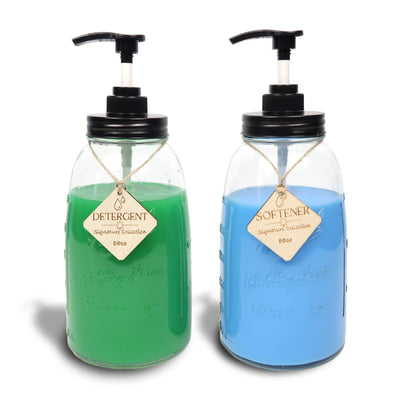 Set of 2 clear glass laundry detergent dispenser bottles with pump, 50oz each, farmhouse-style labels, on laundry room shelf