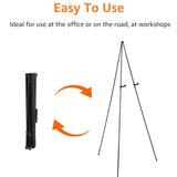 Amazon Basics black steel collapsible tripod easel display stand fully extended on floor holding a poster - view 4