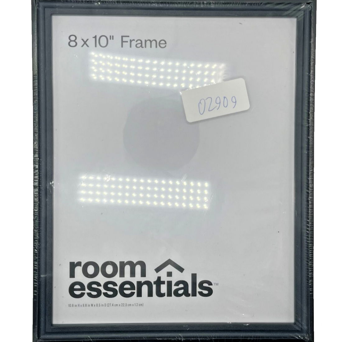 Set of 3 black plastic 8x10 picture frames by Room Essentials displayed on wall in gallery arrangement