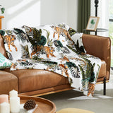 Aqua blue gradient flannel throw blanket 50x60 inches with pom pom trim draped over a sofa or chair - view 2