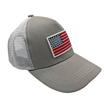 White 6-panel mesh baseball cap with embroidered American flag patch on front, adjustable snapback closure