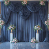 Four navy blue silky backdrop curtain panels 5x12 feet hung on a rod, showing smooth wrinkle-free drape for wedding or photo booth use - view 5
