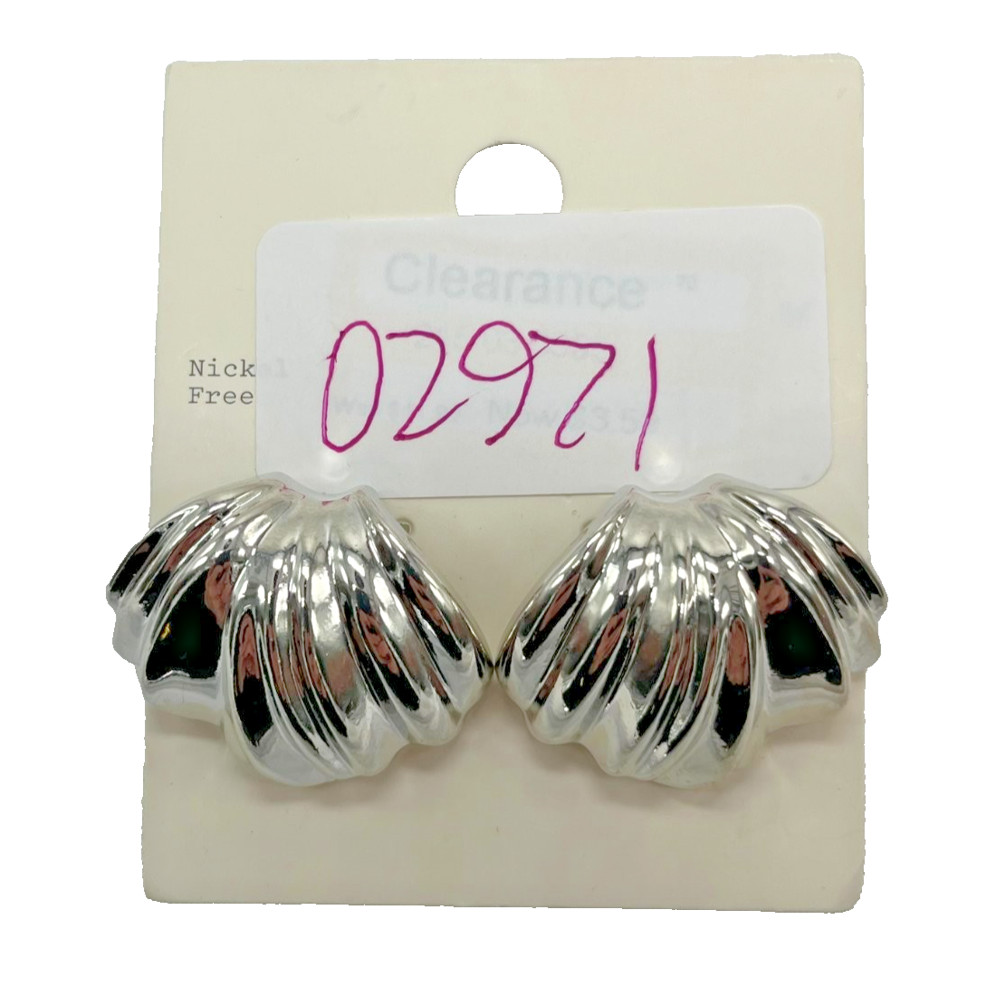 Chunky polished silver-tone scalloped seashell stud earrings with butterfly backing on white background