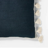 Threshold Studio McGee 20x20 inch navy blue throw pillow with cream woven border and side tassels on sofa - view 5