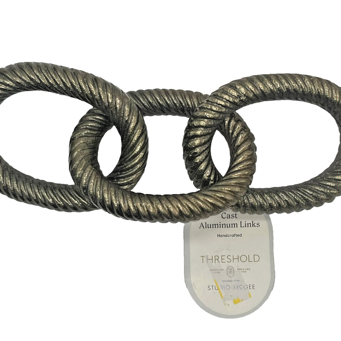 Threshold Studio McGee cast aluminum 3-link chain sculpture with twisted rope texture and antique bronze metallic finish on tabletop