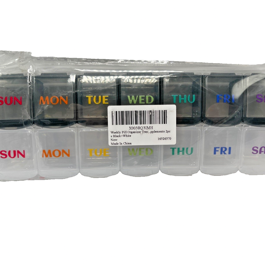 Two weekly pill organizers in black and white with 7 large labeled compartments each, shown open and closed for travel use