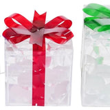 Three lit Christmas gift boxes in small, medium, and large sizes with red, green, and blue bows glowing with warm LED lights - view 5