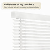 Achim pearl white vinyl cordless mini blind 40x64 inches installed on window with light filtering through slats - view 3