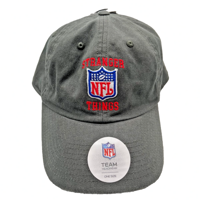 Washed charcoal grey unstructured dad hat with embroidered NFL shield logo and red Stranger Things text on front