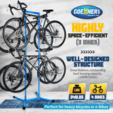GOEHNER's green steel freestanding 4-bike storage rack with rubber-coated hooks standing upright in a garage - view 3