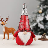 12-inch red and silver flip sequin Christmas gnome plush with white beard standing upright on weighted base