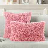 Two pink faux wool boucle throw pillow covers 22x22 inches with gold heart charm zipper on a modern couch - view 2