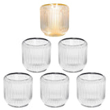 Set of 6 clear ribbed glass candle holders 3.5 inches holding tea light and votive candles on a decorated table
