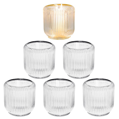 Set of 6 clear ribbed glass candle holders 3.5 inches holding tea light and votive candles on a decorated table