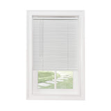 Classic Touch white vinyl cordless 1-inch mini blind 23x64 inches mounted on window with light filtering slats closed