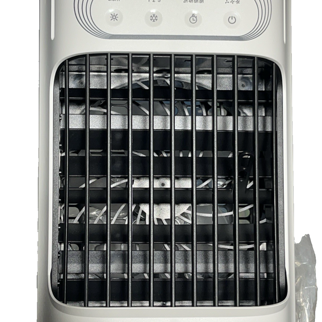 White portable USB desktop evaporative air cooler fan with carry handle on a desk, front-facing view