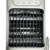 White portable USB desktop evaporative air cooler fan with carry handle on a desk, front-facing view