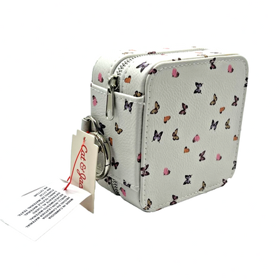 White faux leather travel jewelry case with colorful butterfly print, silver zip closure, and grey suede interior by Cat & Jack