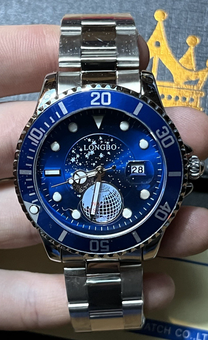 Devaco men's round blue dial stainless steel quartz analog wristwatch with silver bracelet and date display