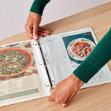 Four white AmazonBasics 1-inch 3-ring binders with clear overlay covers and interior pockets, shown in original packaging - view 2