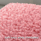 Two pink faux wool boucle throw pillow covers 22x22 inches with gold heart charm zipper on a modern couch - view 3