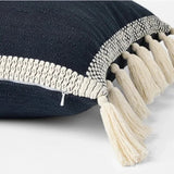 Threshold Studio McGee 20x20 inch navy blue throw pillow with cream woven border and side tassels on sofa - view 2