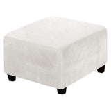Off white velvet stretch slipcover fitted over a large square storage ottoman with elastic hem pulled snug around base