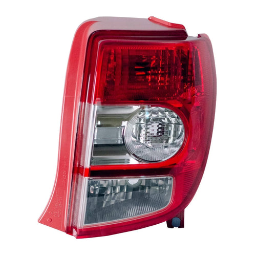Red passenger-side tail light housing assembly for 2008-2014 Scion xD, part 81551-52690, shown in open box