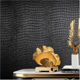 Roll of black crocodile-textured peel and stick vinyl wallpaper 15.7 by 118 inches with embossed grain finish