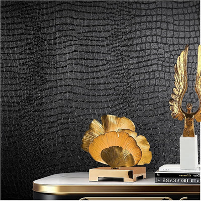 Roll of black crocodile-textured peel and stick vinyl wallpaper 15.7 by 118 inches with embossed grain finish