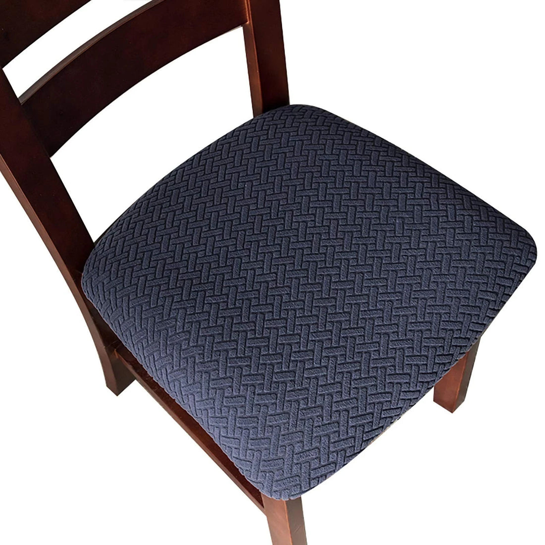 Four navy blue jacquard stretch dining chair seat covers with anti-slip straps laid flat and fitted on chairs
