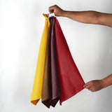 Four waffle weave cotton kitchen dish towels in brown, burgundy, red, and mustard, each 16x26 inches with hanging loop - view 4