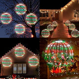 Two 16-inch multicolor LED Christmas ball sphere lights with stainless steel frame glowing outdoors in a yard at night - view 7