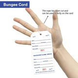 Stack of rectangular coated paper baggage claim check tags numbered in bold red on white, with tear-off stub and transfer tape backing - view 5