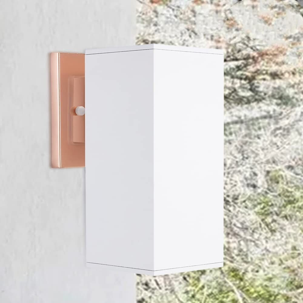 Cerdeco 9-inch outdoor wall sconce with rose gold metal base and white glass shade mounted on exterior wall