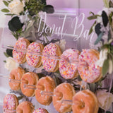 Clear acrylic donut wall display stand 26x22 inches with 25 pegs holding donuts for wedding party decor by Opal Lily - view 4