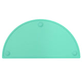 Teal oval silicone placemat 20x11 inches with raised edges and suction cups on a dining table surface
