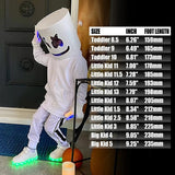 Silver kids LED light-up sneakers with hook and loop closure, size 1, shown from side angle highlighting sole lighting - view 6