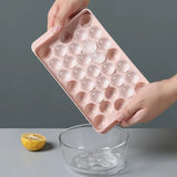 Two round sphere ice ball maker trays with lids in pink and blue BPA-free plastic for whiskey and cocktails - view 7