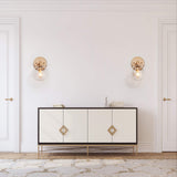 Gold metal wall sconce with handblown seeded globe glass shade 5.5 inch diameter mounted on wall, warm ambient light - view 4
